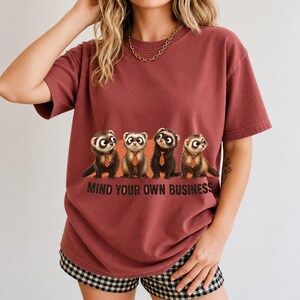 Four ferrets in tiny ties in a row with the text "Mind Your Own Business"