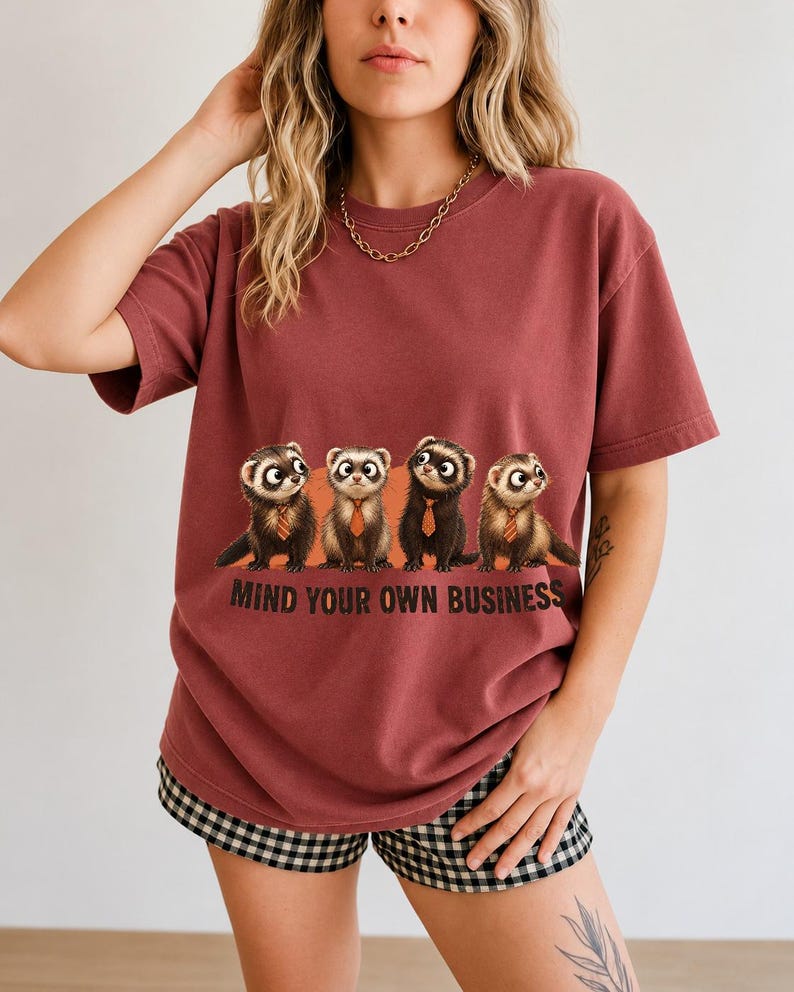 Four ferrets in tiny ties in a row with the text "Mind Your Own Business"