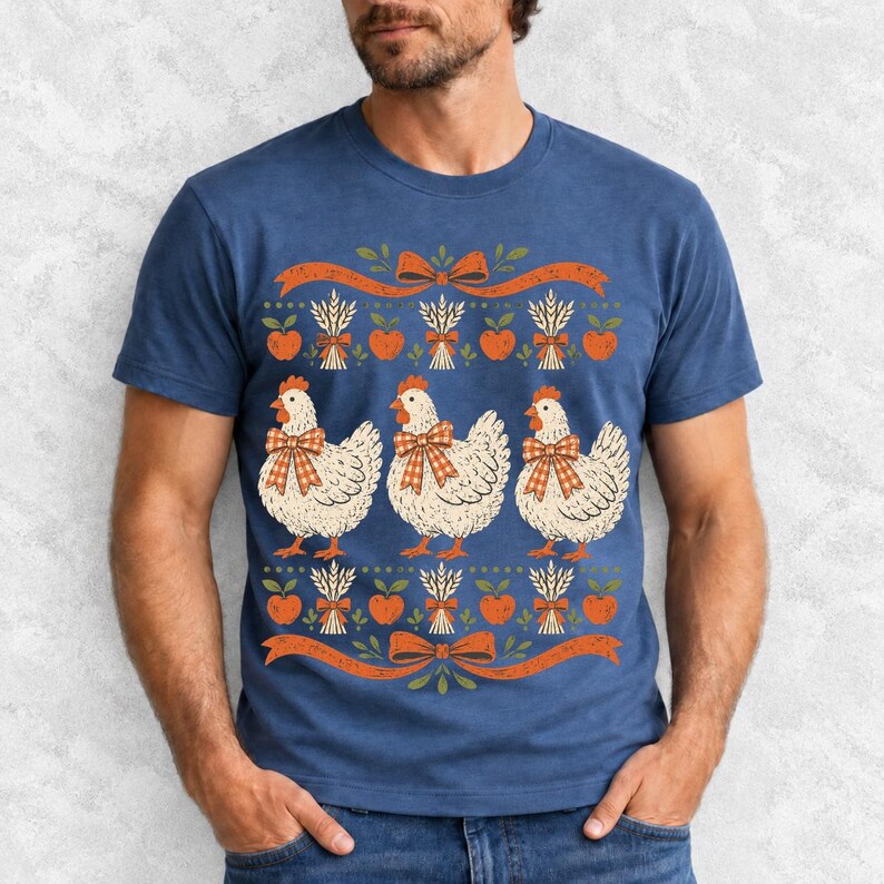 Three fluffy hens with gingham bows between apple and wheat borders, retro folk art fall t-shirt design