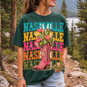 Pink embroidered cowboy boot with blooming cactus over a five-line stacked NASHVILLE word in retro colors