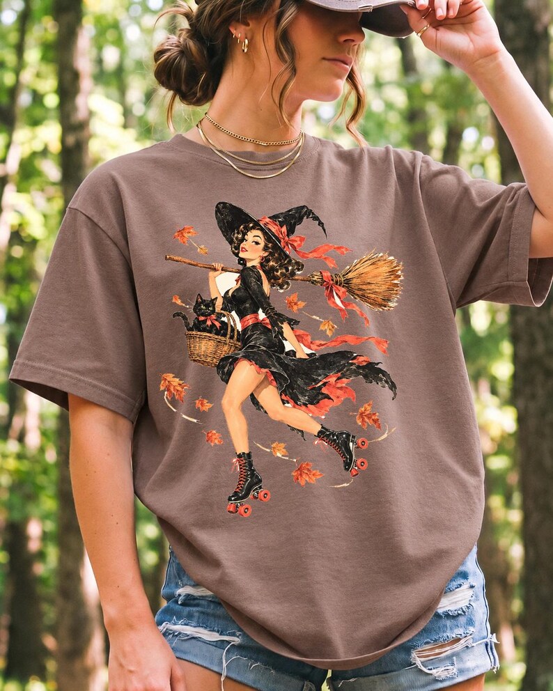 Retro 1950s pin-up witch on roller skates with a broom and a cat in a basket, autumn leaves