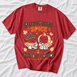 Acorn and pumpkin characters in pharmacist coats holding pill organizers, text Pumpkin Spice & Patient Advice