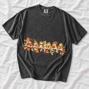 Row of watercolor sparrows on a branch holding tiny apples, corn and a pumpkin for harvest