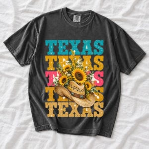 Straw cowboy hat full of sunflowers over a five-line stacked TEXAS word in retro western colors