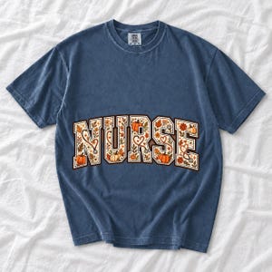 Arched varsity word NURSE filled with autumn leaves, stethoscopes and pumpkins in cream, rust and mustard