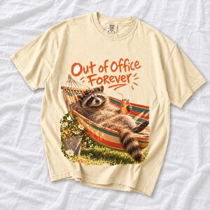 Raccoon relaxing in a hammock with a soda can and sunglasses, 90s film photo style, text "Out of Office Forever"