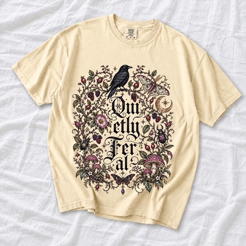 Raven on a wild rose branch with beetles and berries around blackletter text "Quietly Feral"