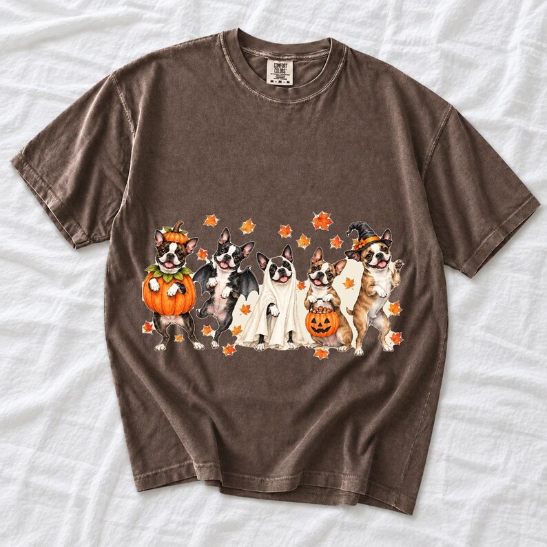 Five watercolor Boston terriers in Halloween costumes with falling autumn leaves