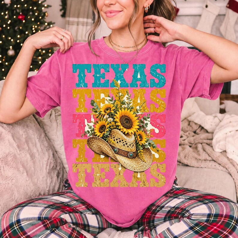 Straw cowboy hat full of sunflowers over a five-line stacked TEXAS word in retro western colors