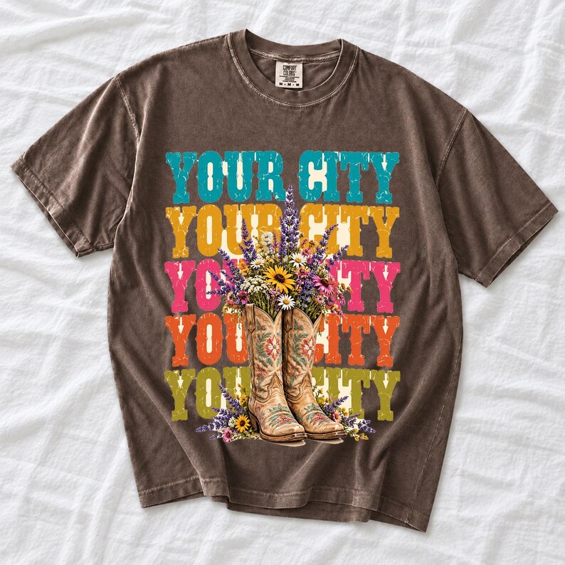 Tan cowboy boots with lavender and wildflowers over a five-line stacked personalized city word in retro colors