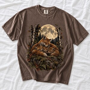 Fox family curled on a rock under a huge full moon among birch trees, dark realistic woodland illustration