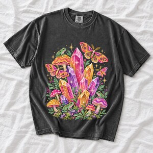 Retro 70s psychedelic glitter crystal cluster with moths and small frogs in pink, mustard, violet and mint