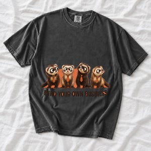 Four ferrets in tiny ties in a row with the text "Mind Your Own Business"