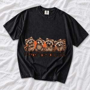 Four raccoons in a row with the text "Support Your Local Gaze"