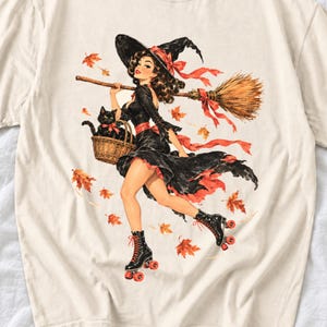 Retro 1950s pin-up witch on roller skates with a broom and a cat in a basket, autumn leaves