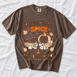 Acorn and pumpkin characters in pharmacist coats holding pill organizers, text Pumpkin Spice & Patient Advice