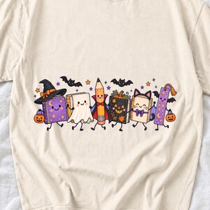 Kawaii books, pencil and bookmark with faces in Halloween costumes, pastel purple and orange