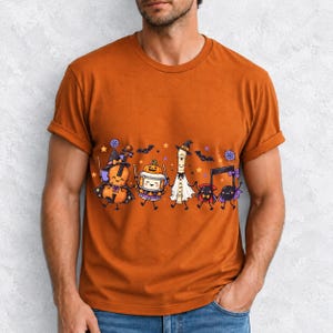 Kawaii violin, drum, recorder and notes with faces in Halloween costumes, pastel purple and orange