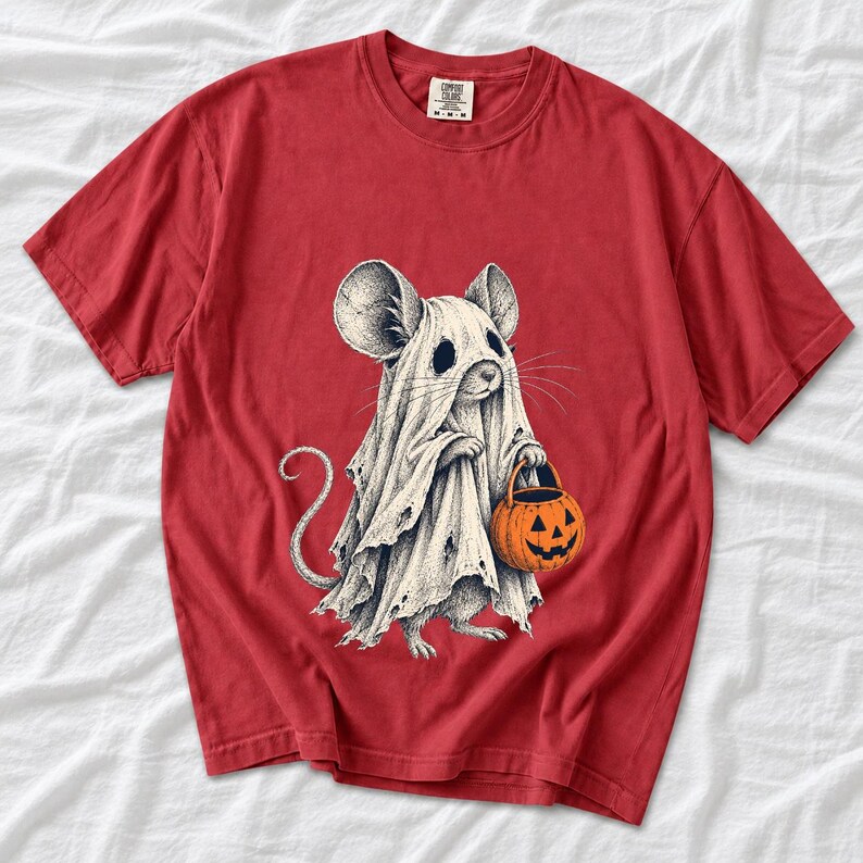 Etched pen illustration of a small mouse in a sheet ghost costume holding a candy bucket, bone white with orange accent