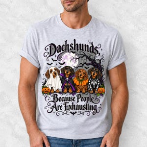 Four dachshunds in Halloween costumes under a spooky tree with text Dachshunds, Because People Are Exhausting