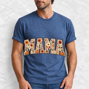 Arched varsity word MAMA filled with fall flowers and acorns in cream, rust and mustard