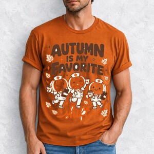 Cute pumpkin characters in nurse caps with clipboards and coffee, text Autumn Is My Favorite Shift