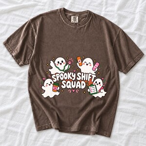 Four kawaii ghosts with stethoscope, bandages, coffee and clipboard, text Spooky Shift Squad
