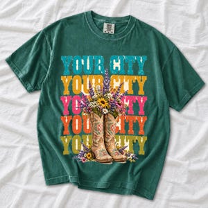 Tan cowboy boots with lavender and wildflowers over a five-line stacked personalized city word in retro colors