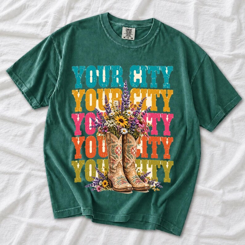 Tan cowboy boots with lavender and wildflowers over a five-line stacked personalized city word in retro colors