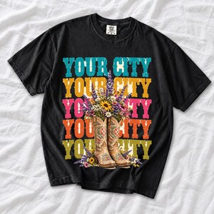Tan cowboy boots with lavender and wildflowers over a five-line stacked personalized city word in retro colors