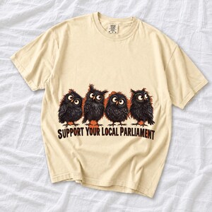 Four fluffy big-eyed black owls in a row with the text "Support Your Local Parliament"
