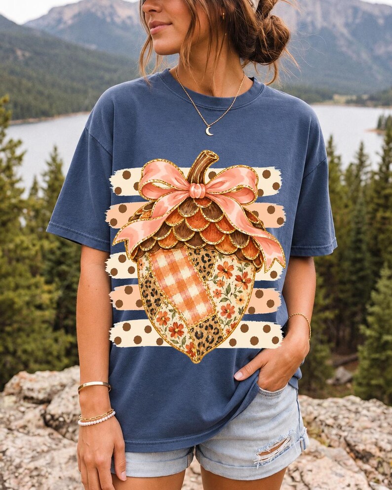 Giant patchwork acorn with a pink satin bow made of plaid, leopard and floral fabric on polka-dot stripes