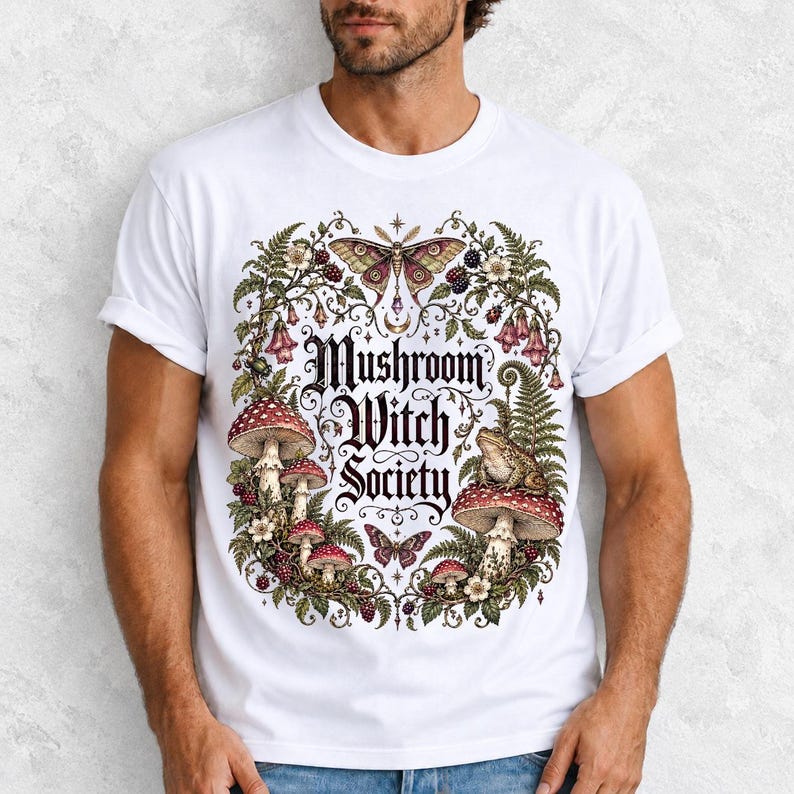 Blackletter text "Mushroom Witch Society" framed by fly agaric mushrooms, ferns and a toad on a mushroom cap