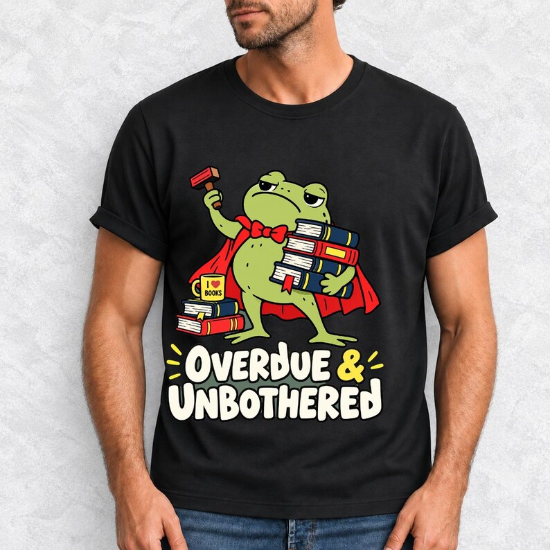 Grumpy cartoon frog librarian holding a stamp and a stack of books with the text Overdue & Unbothered