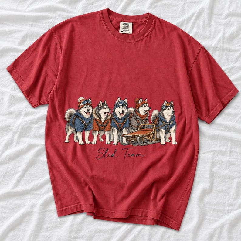 Illustrated huskies in ski gear lined up with a sled, text Sled Team