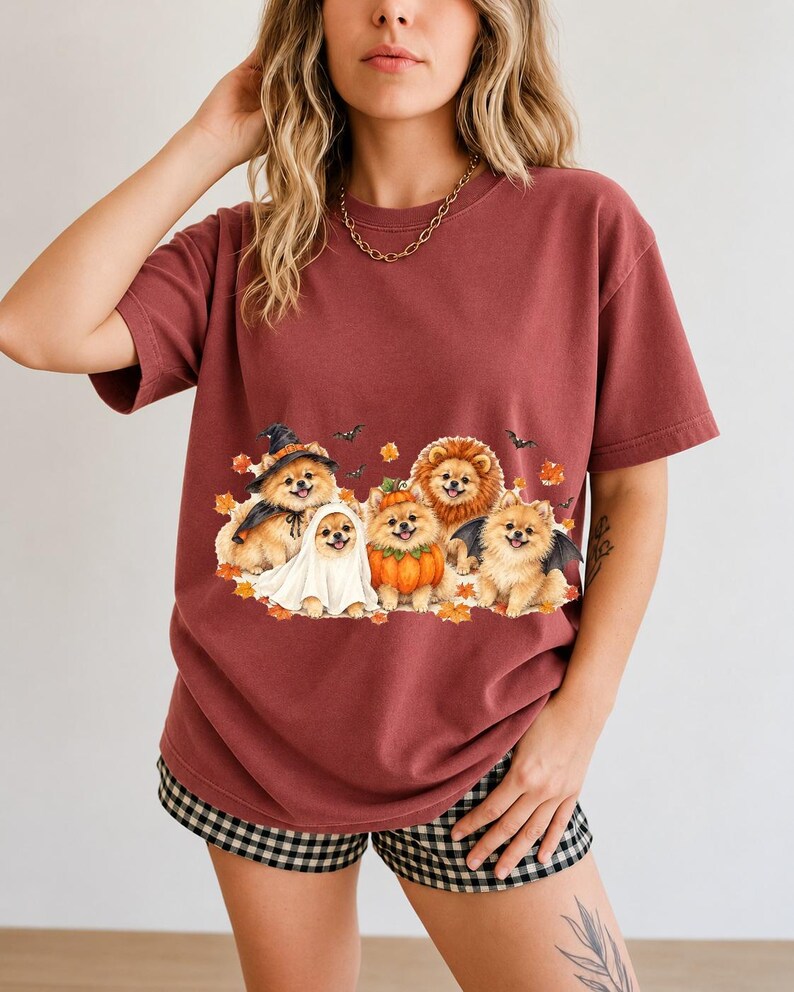 Five fluffy watercolor pomeranians in Halloween costumes with autumn leaves and bats