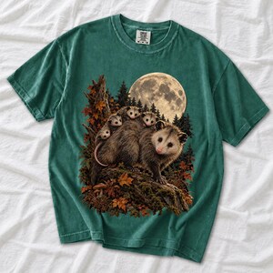 Mother opossum with babies on her back under a full moon and autumn leaves, dark realistic woodland illustration