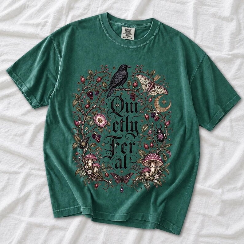 Raven on a wild rose branch with beetles and berries around blackletter text "Quietly Feral"