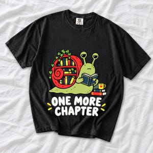 Cartoon snail reading a book with a bookshelf shell and the text One More Chapter