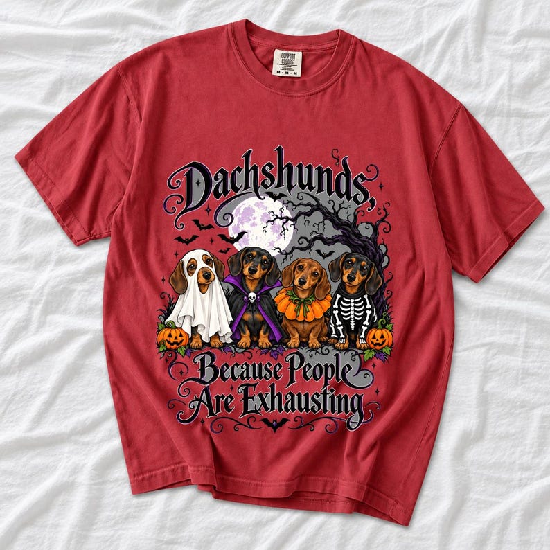 Four dachshunds in Halloween costumes under a spooky tree with text Dachshunds, Because People Are Exhausting