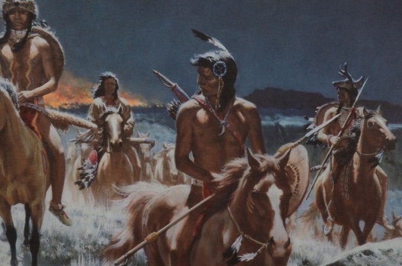 May include: A group of Native American warriors on horseback ride through a landscape with a fire in the background. The warriors are wearing traditional clothing and carrying weapons. The horses are brown and white.