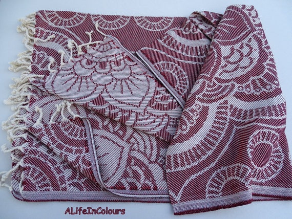 red patterned bath towels