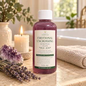 May include: A clear plastic bottle filled with purple liquid, featuring a white label that reads House of Sereiah Emotional Uncrossing Spiritual Bath, 9 fl oz. The bottle has a white cap and is designed for external use only.