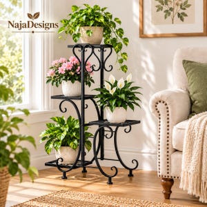 May include: A black metal plant stand with four tiers featuring scrollwork accents. The stand holds four potted plants: a trailing pothos, pink flowers in a textured white pot, a peace lily, and a green leafy plant in a speckled pot. Text reads NajaDesigns.