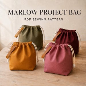 May include: Four drawstring project bags in olive green, deep burgundy, mustard yellow, and dusty rose. Each bag features a tan leather handle and white cord ties. The text MARLOW PROJECT BAG PDF SEWING PATTERN is displayed at the top of the image.