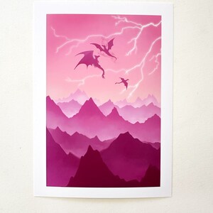 May include: Three black silhouettes of dragons flying in a pink and purple mountain range with lightning strikes in the sky.