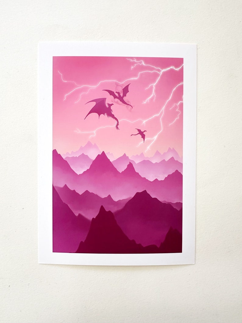 May include: Three black silhouettes of dragons flying in a pink and purple mountain range with lightning strikes in the sky.