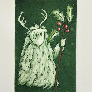 May include: A green and white illustration of a furry creature with antlers holding a sprig of holly with red berries. The creature is standing on a green background.