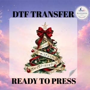 May include: A DTF transfer ready to press featuring a Christmas tree decorated with a large red bow, musical staff ribbons, gold bells, and red ornaments. The tree is topped with a treble clef star. Text reads DTF TRANSFER and READY TO PRESS.