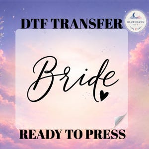 May include: A DTF transfer sheet featuring the black text Bride in a cursive script font with a small heart icon at the end. The text DTF TRANSFER is printed above and READY TO PRESS is printed below the design on a white rectangular background.